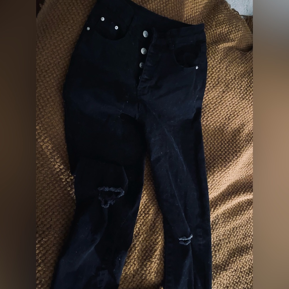 Black high waisted button fly knee slit skinny jeans